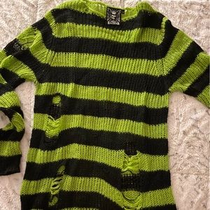 Black and green distressed light sweater